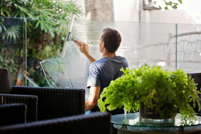 Man Cleaning Glass Wall