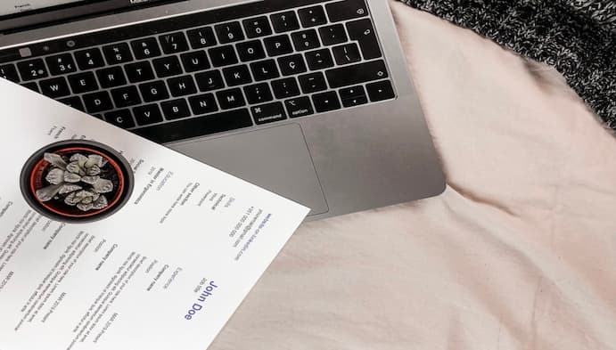 resume paper near laptop